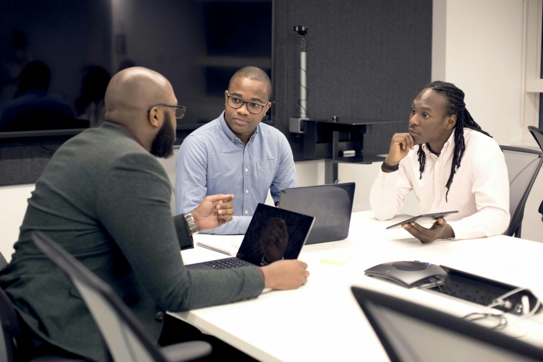 Black professionals in a focused business discussion